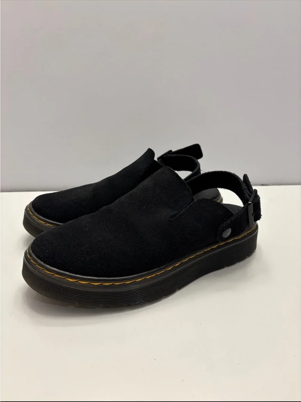 Dr. Martens Carlson slingback mules in black suede, with a chunky buckle